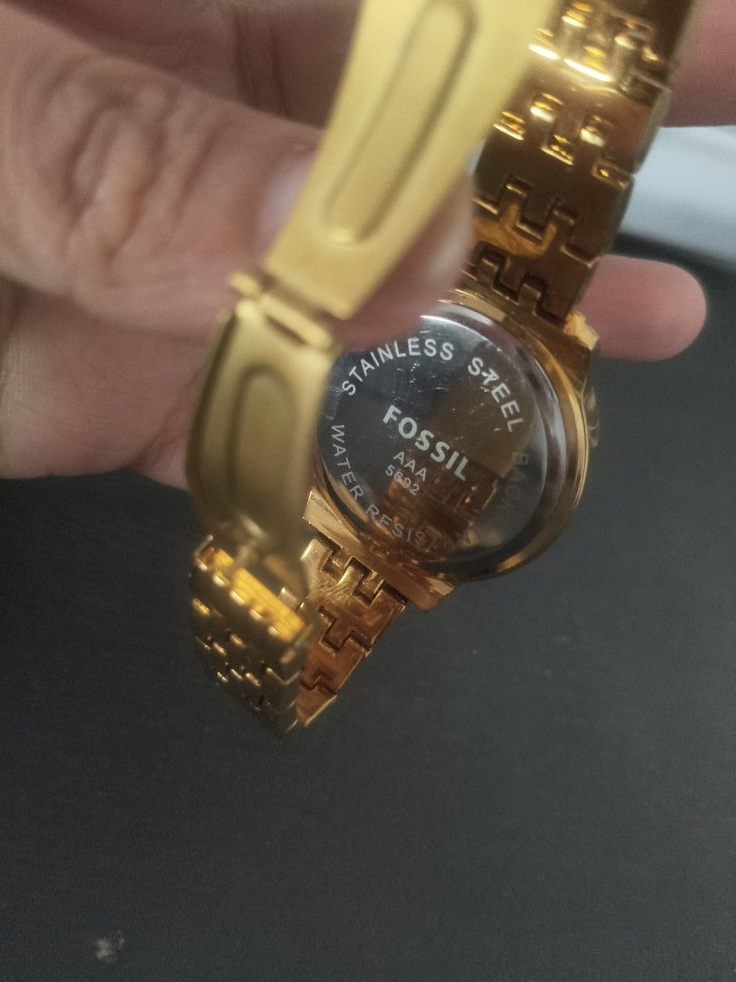 Fossil Gold Chronograph Crystal Bezel Watch (Category: Women's Watches) located in San Fernando. Submitted by pollygirl08 (Listing ID 1466605421, Image 2). Description: - Brand: Fossil (Model AAA 5692) - Color: Elegant gold-tone with a champagne dial - Design: Round face with dazzling crystal -No battery stones around the bezel - Features: 3 sub-dials and a convenient date window at the bottom right - Strap: Stainless steel link bracelet with sec