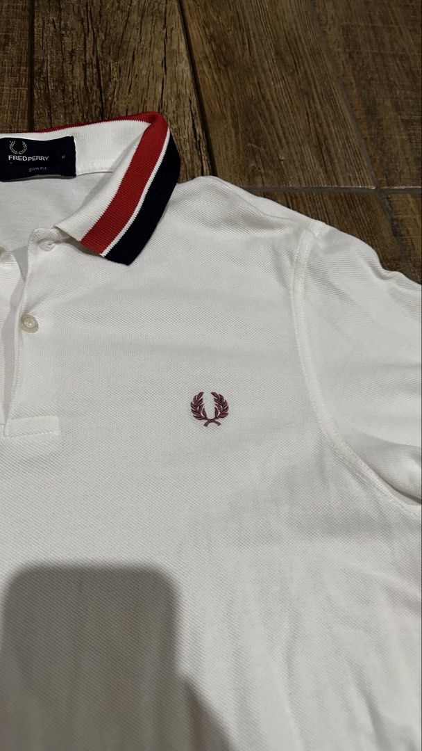 FRED PERRY WHITE POLO (Category: Tshirts & Polo Shirts ) located in Manila. Submitted by urban.vintage (Listing ID 1466748542, Image 3). Description: ISSUE: NONE (NEED WASH) MOP :GCASH (NO COD) SHIP VIA: LALAMOVE & J&T LOCATION: PASIG CITY LENGTH: 27 WIDTH : 19.