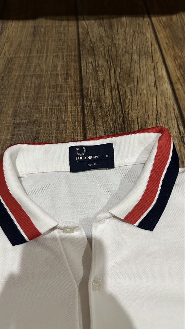 FRED PERRY WHITE POLO (Category: Tshirts & Polo Shirts ) located in Manila. Submitted by urban.vintage (Listing ID 1466748542, Image 2). Description: ISSUE: NONE (NEED WASH) MOP :GCASH (NO COD) SHIP VIA: LALAMOVE & J&T LOCATION: PASIG CITY LENGTH: 27 WIDTH : 19.