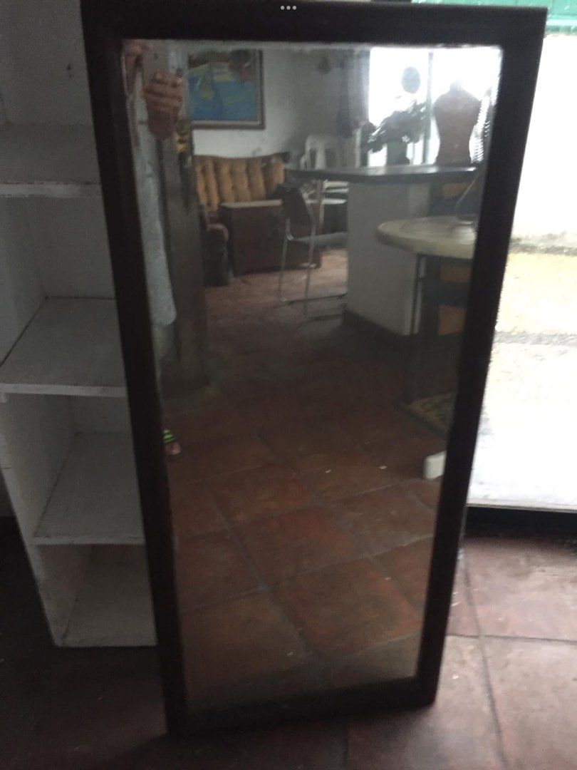 Full length standing mirror with dark wood frame (Category: Mirrors) located in Manila. Submitted by roberto.enriquez (Listing ID 1466768544, Image 3). Description: - Type: Large full-length floor mirror - Frame: Thick, dark brown solid wood - Reflection: Clear, high-quality, distortion-free from head to toe - Placement: Ideal for bedrooms, entryways, or living spaces - Condition/Build: Sturdy and heavy-duty construction - Fulfillment: Pick up on