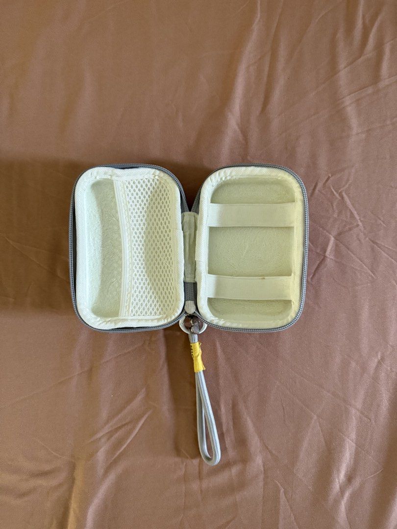 G7X Mark III Camera Case (durable) (Category: Camera Bags & Carriers) located in Pasay City. Submitted by cheyennesayson (Listing ID 1466574202, Image 1). Description: - Color: Grey - Material: Textured PU leather exterior with soft padded interior - Features: Built-in mesh pocket for accessories, secure zipper closure, and convenient wrist strap with 'NICE' tag - Condition: Layered condition 4, well-maintained.