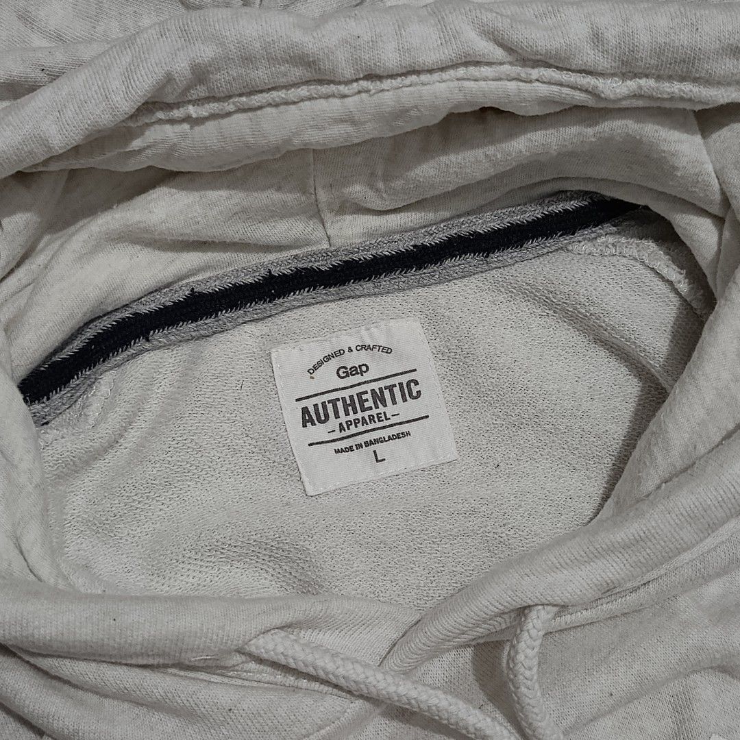 GAP Arch Logo Heather Gray Hoodie (Category: Hoodies) located in Bay. Submitted by ndrwthrift (Listing ID 1466764368, Image 3). Description: GAP Arch Logo Heather Gray Hoodie Condition - 9/10 Size - Large on tag Dimes - L 28" W 21" Color Rate - 9/10 Issue - Small dot stain (Needs Wash) *meet up or shipping via lalamove (buyer's expense) *can ship nationwide via j&t.