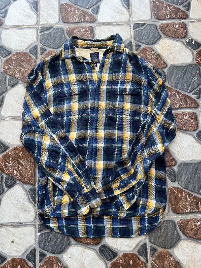 Gap x Pendleton Plaid Flannel Shirt Medium (Category: Tshirts & Polo Shirts ) located in Caloocan City. Submitted by sillapwet0606 (Listing ID 1466565923, Image 1). Description: - Brand: Gap x Pendleton collaboration - Size: Medium regular fit - Pattern: Navy blue, yellow, and green plaid - Material: Thick, warm fabric ideal for cooler weather - Design: Classic button-down front with two chest pockets - Origin: Made in Sri Lanka.