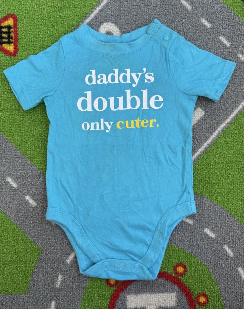 Garanimals Onesie Bodysuit (Category: Babies & Kids Fashion) located in Rizal. Submitted by preloovved (Listing ID 1466688469, Image 1). Description: Bright blue baby bodysuit featuring a cute 'daddy's double only cuter' print. Designed with short sleeves and convenient snap buttons at the shoulder and bottom for easy dressing and diaper changes. New, 3-6mos Meet-up only in GB1 San Mateo, Rizal Shipping fee c/o buyer. Tres Marias or J&T express P