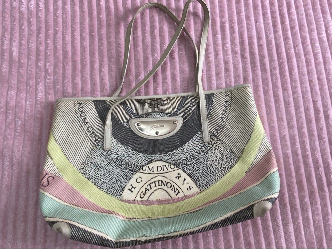 Gattinoni patterned shoulder bag tote (Category: Shoulder Bags) located in Paranaque City. Submitted by axie1206 (Listing ID 1466600668, Image 1). Description: - Gattinoni shoulder bag - Eye-catching banknote-style printed graphics - Charming pastel stripe bands along the bottom curve - Cream leather-look shoulder straps with secure silver hardware - Branded metal plaque on the front face - Spacious interior compartment, perfect for daily essenti