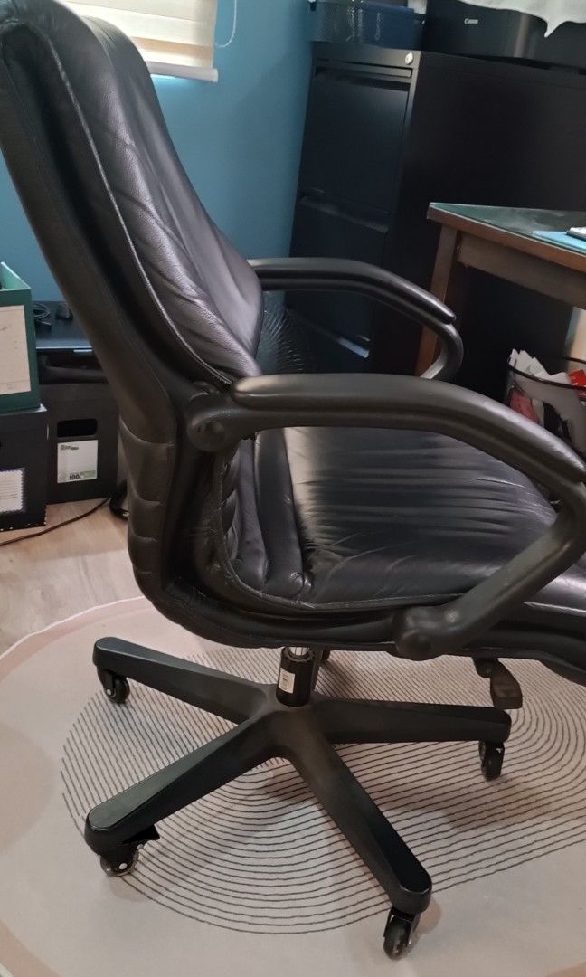 GENUINE LEATHER EXECUTIVE OFFICE CHAIR (Category: Office Furniture & Fixtures) located in Quezon City. Submitted by silentwind.8f452f (Listing ID 1466570969, Image 1). Description: GENUINE LEATHER EXECUTIVE OFFICE CHAIR Selling a pre-owned, high-back executive office chair in good condition. Black leather upholstery (appears genuine) Padded armrests Adjustable seat height Reclining mechanism Swivel base with caster wheels All mechanisms fully fun