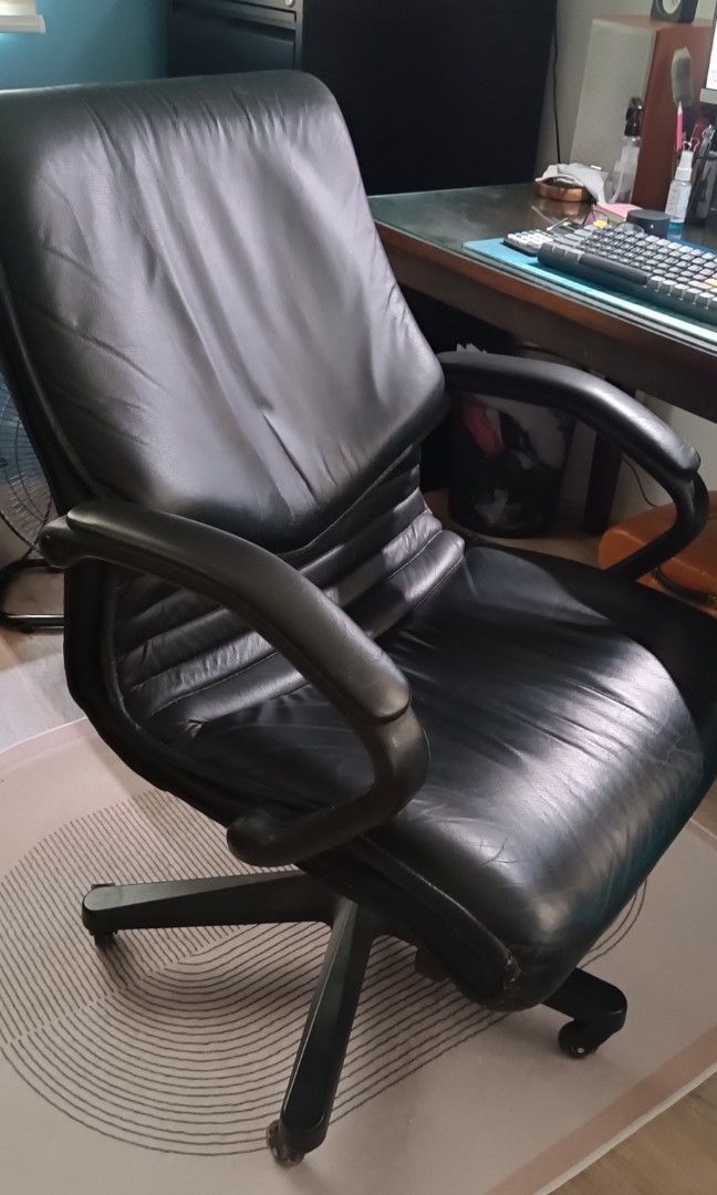 GENUINE LEATHER EXECUTIVE OFFICE CHAIR (Category: Office Furniture & Fixtures) located in Quezon City. Submitted by silentwind.8f452f (Listing ID 1466570969, Image 3). Description: GENUINE LEATHER EXECUTIVE OFFICE CHAIR Selling a pre-owned, high-back executive office chair in good condition. Black leather upholstery (appears genuine) Padded armrests Adjustable seat height Reclining mechanism Swivel base with caster wheels All mechanisms fully fun