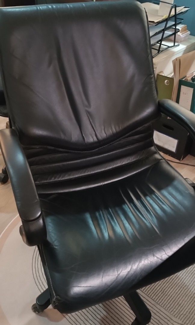 GENUINE LEATHER EXECUTIVE OFFICE CHAIR (Category: Office Furniture & Fixtures) located in Quezon City. Submitted by silentwind.8f452f (Listing ID 1466570969, Image 2). Description: GENUINE LEATHER EXECUTIVE OFFICE CHAIR Selling a pre-owned, high-back executive office chair in good condition. Black leather upholstery (appears genuine) Padded armrests Adjustable seat height Reclining mechanism Swivel base with caster wheels All mechanisms fully fun