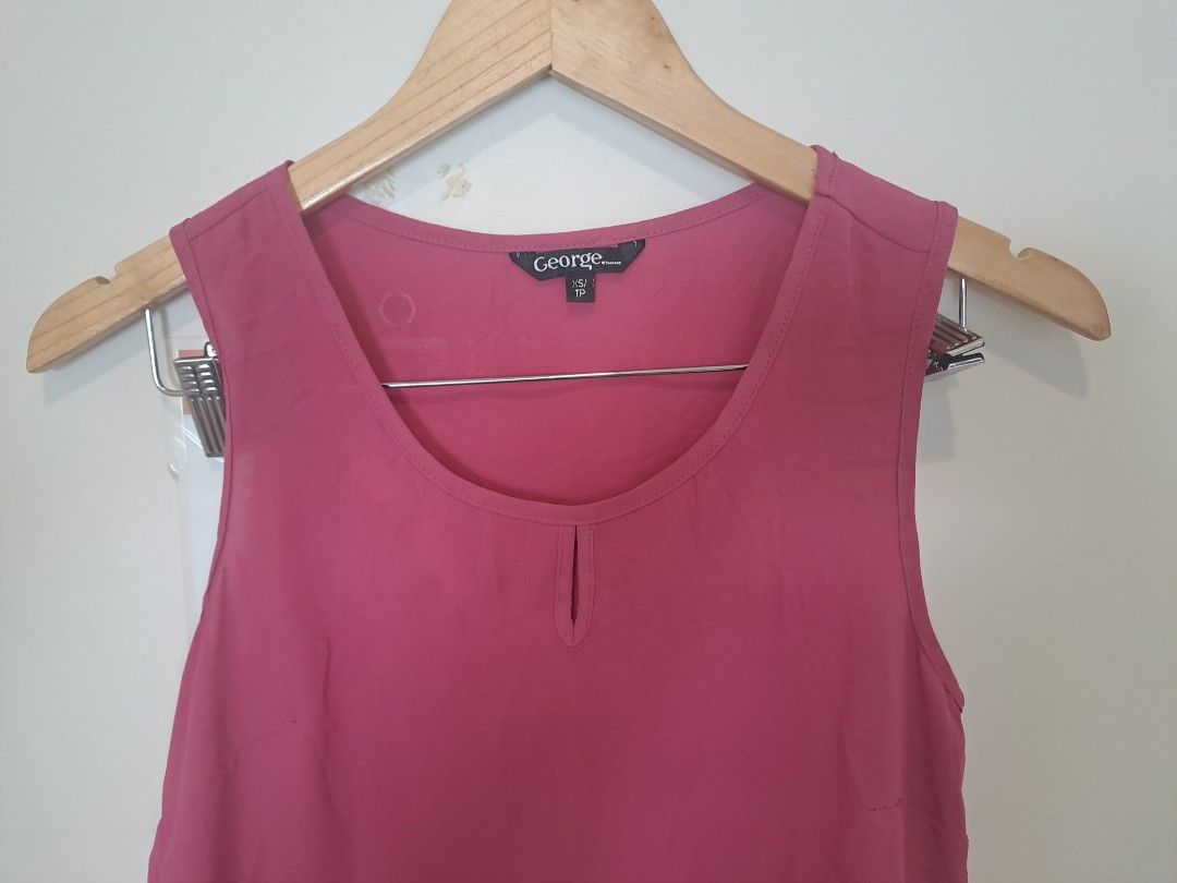 George sleeveless (Category: Sleeveless) located in Manila. Submitted by joanbalde39643 (Listing ID 1466662690, Image 1). Description: This is a women's mauve/dark pink sleeveless keyhole blouse from the brand George. It features a relaxed fit, a rounded neckline with a subtle vertical keyhole cut-out at the front center, and lightweight, flowy fabric suitable for casual or business-casual layering..