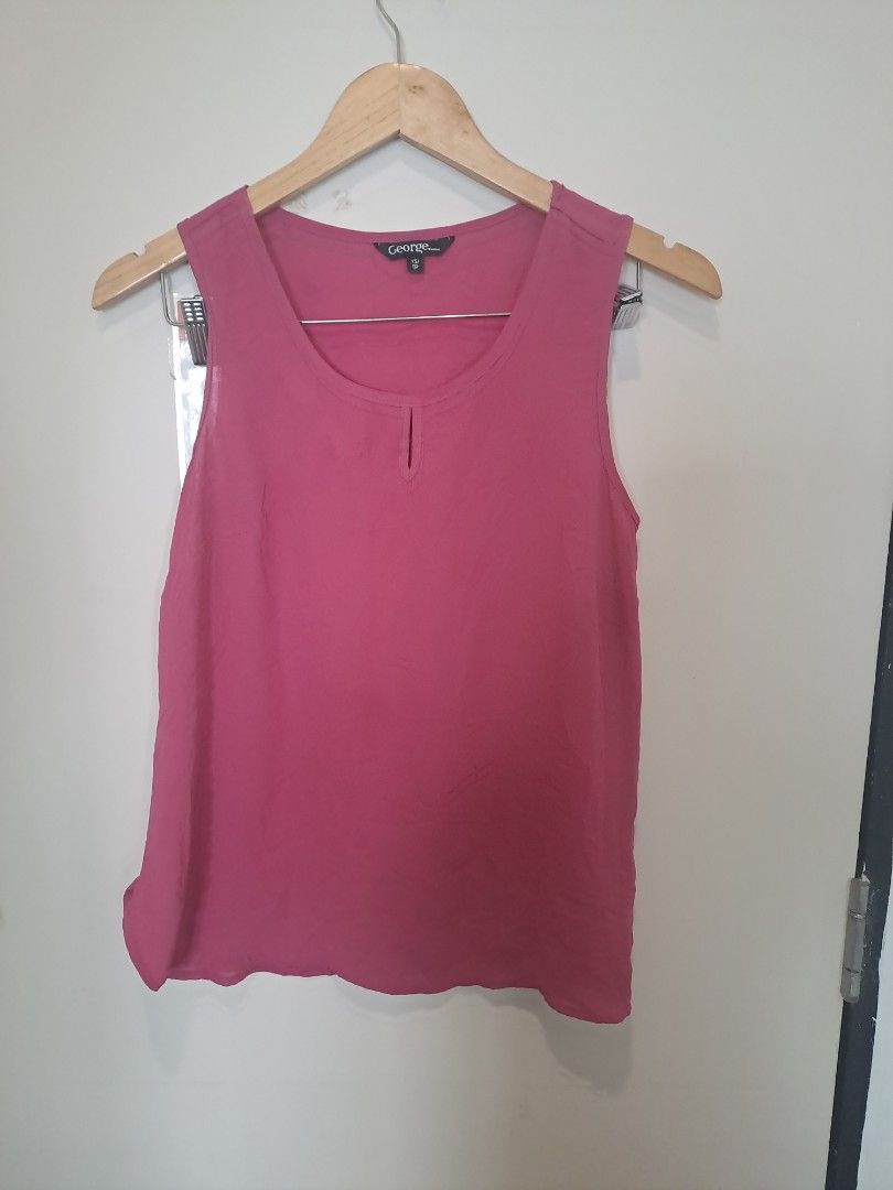 George sleeveless (Category: Sleeveless) located in Manila. Submitted by joanbalde39643 (Listing ID 1466662690, Image 2). Description: This is a women's mauve/dark pink sleeveless keyhole blouse from the brand George. It features a relaxed fit, a rounded neckline with a subtle vertical keyhole cut-out at the front center, and lightweight, flowy fabric suitable for casual or business-casual layering..