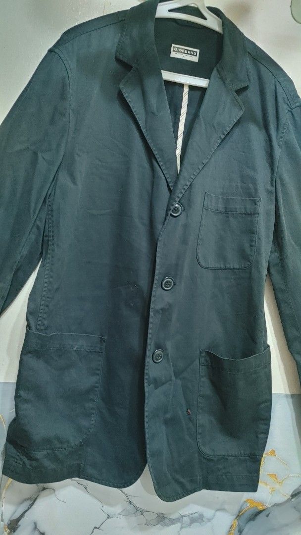 Giordano Black Casual Blazer Jacket XL (Category: Coats, Jackets and Outerwear) located in Quezon City. Submitted by chph3rd (Listing ID 1466773272, Image 2). Description: - Brand: Giordano - Color: Black (solid, easy to match) - Size: XL - Closure: Three-button front - Pockets: Three patch pockets (one chest, two hem) - Details: Striped accent tape along the inner collar seam - Condition: Clean and ready to wear.