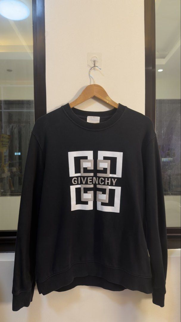 Givenchy Black Logo Sweatshirt (Category: Coats, Jackets and Outerwear) located in Paranaque City. Submitted by preluxeshop_ph (Listing ID 1466765495, Image 2). Description: Givenchy Black Logo Sweatshirt -Iconic Givenchy logo on front -Condition: 9.8/10 -Dimes: Length: 25” Width: 23”.