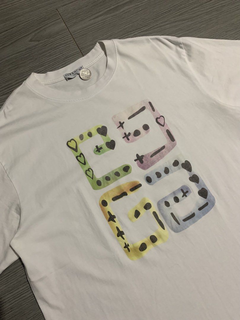 Givenchy Distinctive Pastel Dotted Block Graphic T-Shirt (Category: Luxury Apparel) located in Pozorrubio. Submitted by plco. (Listing ID 1466730798, Image 2). Description: Givenchy Distinctive Pastel Dotted Block Graphic T-Shirt L on tag 22.5x28 color rate: 10/10 complete tags excellent condition no issue.
