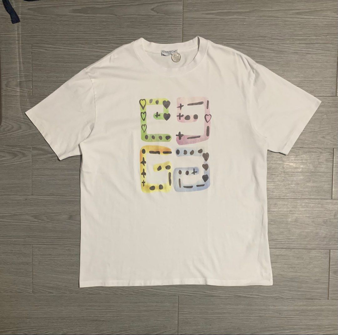 Givenchy Distinctive Pastel Dotted Block Graphic T-Shirt (Category: Luxury Apparel) located in Pozorrubio. Submitted by plco. (Listing ID 1466730798, Image 1). Description: Givenchy Distinctive Pastel Dotted Block Graphic T-Shirt L on tag 22.5x28 color rate: 10/10 complete tags excellent condition no issue.