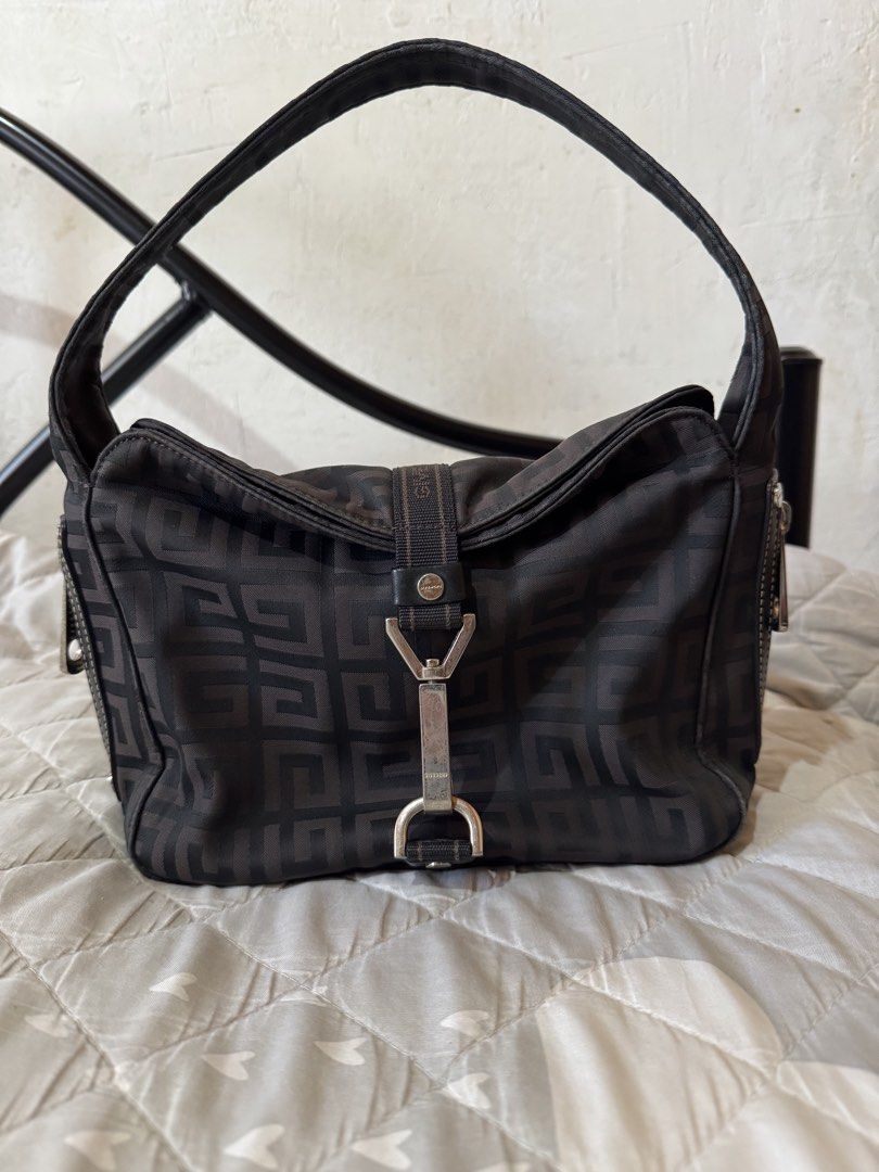 Givenchy vintage small hobo bag (Category: Luxury Bags & Wallets) located in Danao, Cebu. Submitted by jojie.1983 (Listing ID 1466606079, Image 1). Description: - authentic hobo vihtage bag looks cute and pretty no issue of the body looks new ( but the main issue the lock pls see detailed photos na lustred na yomg spring sa lock nya Brand: Givenchy - Color/Pattern: Brown with geometric monogram print - Material: Durable fabric body with comfortab