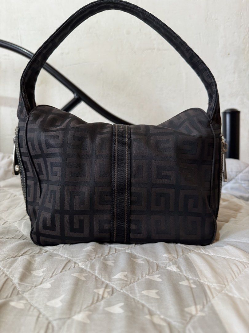 Givenchy vintage small hobo bag (Category: Luxury Bags & Wallets) located in Danao, Cebu. Submitted by jojie.1983 (Listing ID 1466606079, Image 2). Description: - authentic hobo vihtage bag looks cute and pretty no issue of the body looks new ( but the main issue the lock pls see detailed photos na lustred na yomg spring sa lock nya Brand: Givenchy - Color/Pattern: Brown with geometric monogram print - Material: Durable fabric body with comfortab