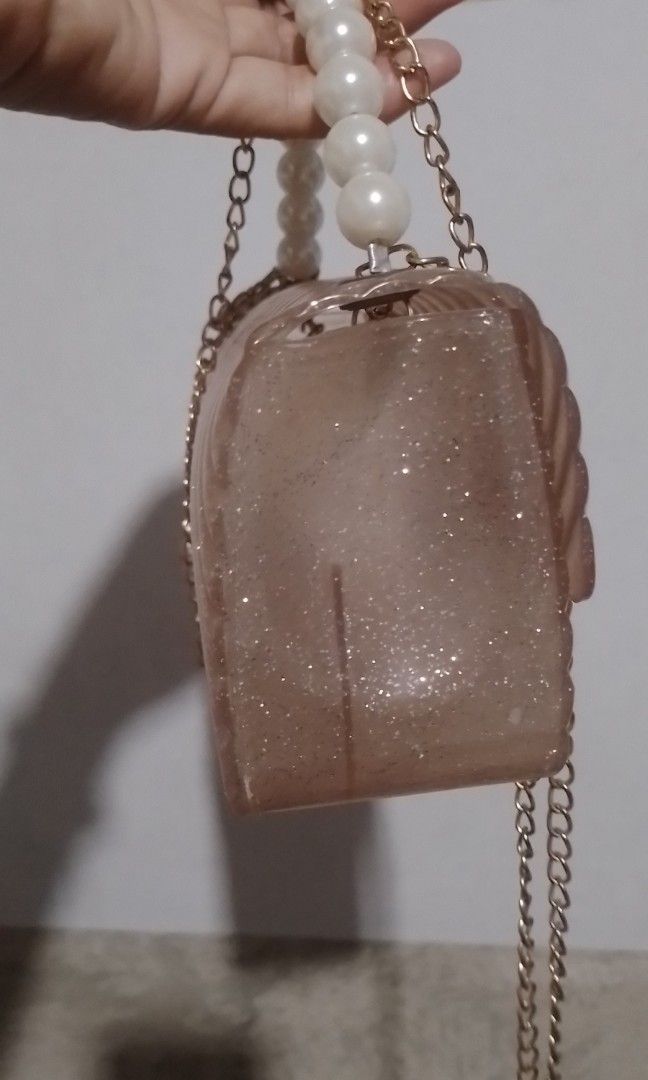 Glittery Jelly Sling Bag (Category: Purses & Pouches) located in Batangas. Submitted by zenrez_shop (Listing ID 1466693635, Image 3). Description: Kasya phone and eyeglasses sa loob may compartment sya..