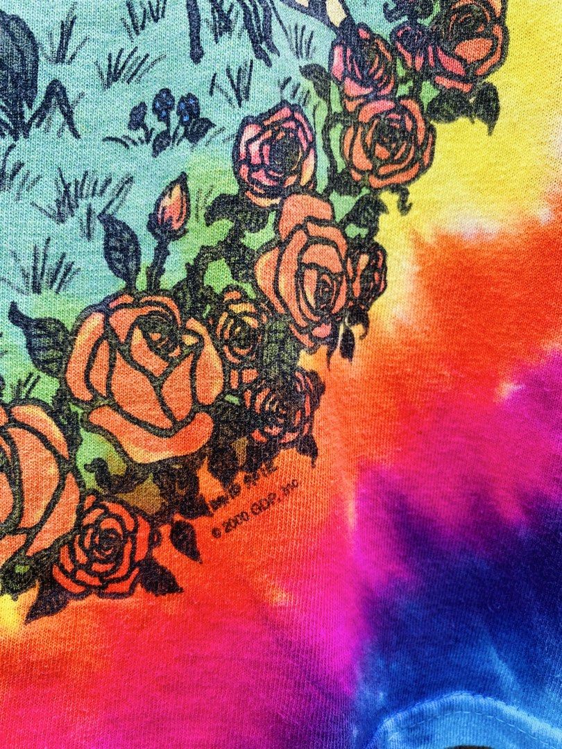 Grateful Dead 2000 Tie-Dye Summer (Category: Tshirts & Polo Shirts ) located in Bayugan. Submitted by reymarcastro56 (Listing ID 1466617285, Image 3). Description: - Official 2000 Grateful Dead tour shirt (GDP Inc.) - Vibrant rainbow tie-dye pattern - Classic psychedelic graphics on front and back - Features iconic dancing bears, VW bus, and rose border artwork - Short sleeves with a comfortable crew neck - Perfect for fans and vintage band tee c