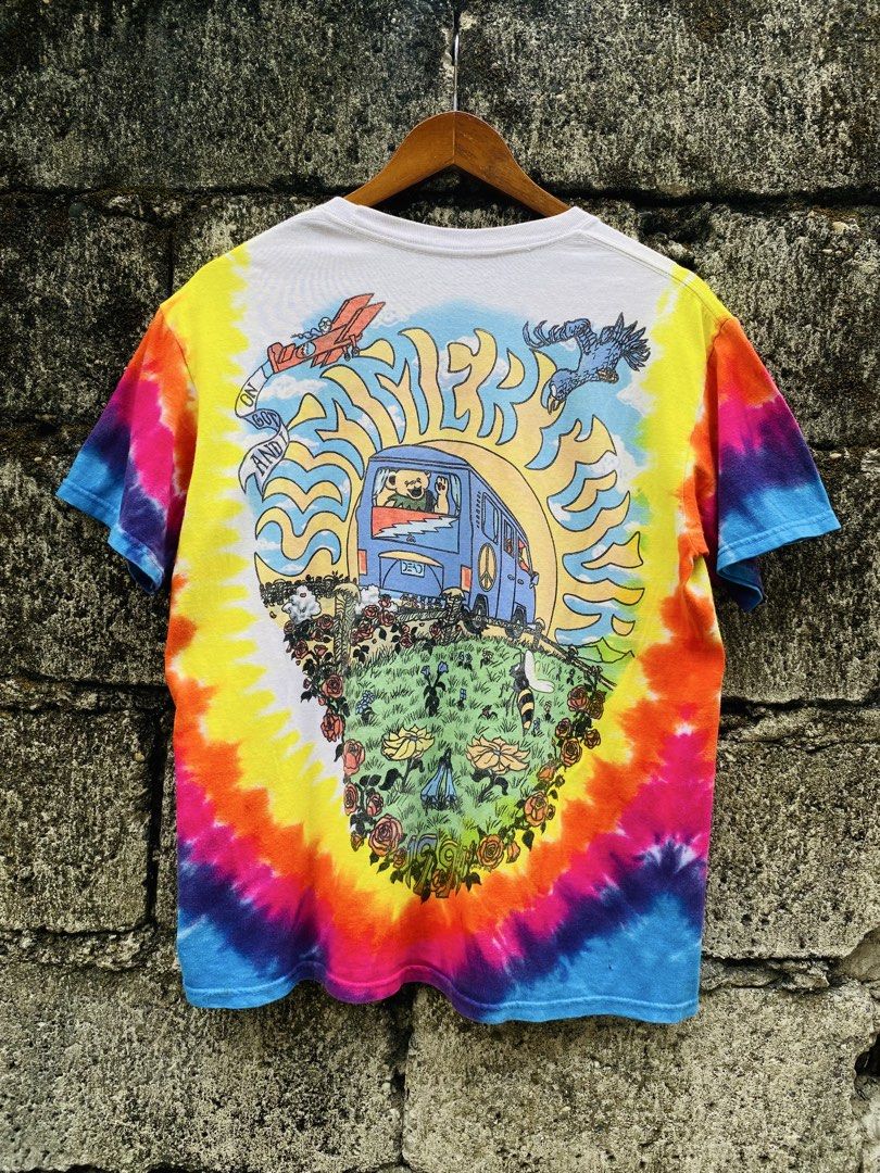 Grateful Dead 2000 Tie-Dye Summer (Category: Tshirts & Polo Shirts ) located in Bayugan. Submitted by reymarcastro56 (Listing ID 1466617285, Image 2). Description: - Official 2000 Grateful Dead tour shirt (GDP Inc.) - Vibrant rainbow tie-dye pattern - Classic psychedelic graphics on front and back - Features iconic dancing bears, VW bus, and rose border artwork - Short sleeves with a comfortable crew neck - Perfect for fans and vintage band tee c