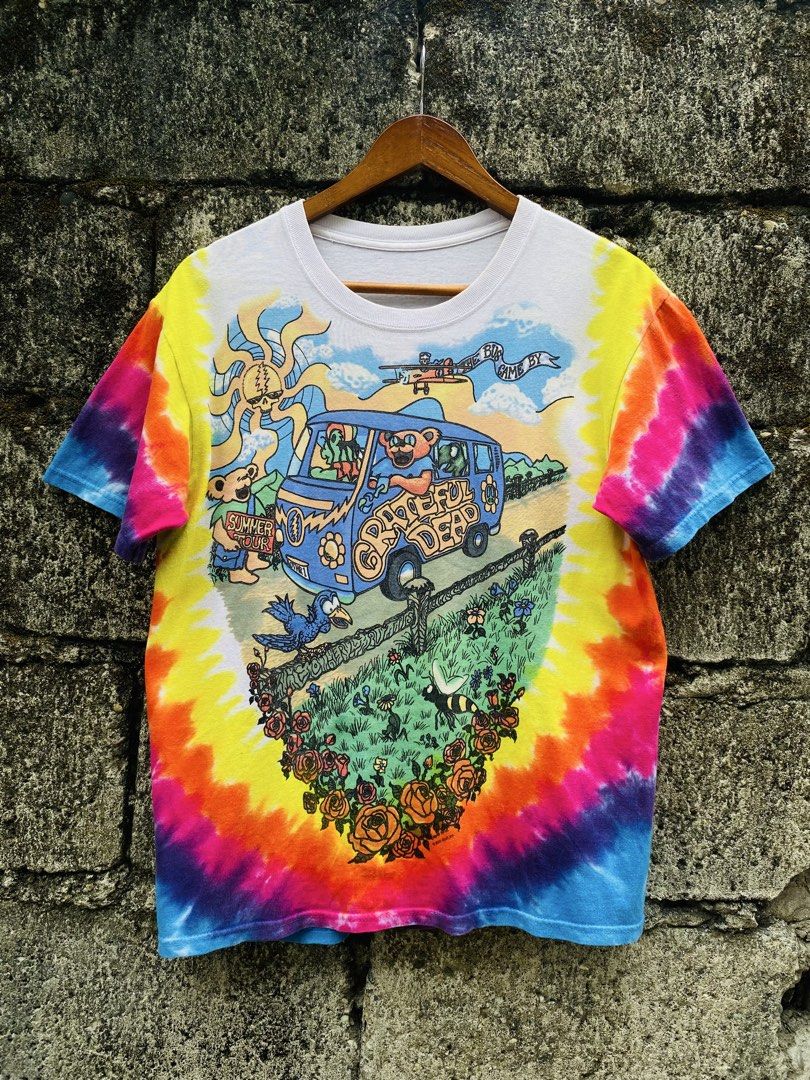 Grateful Dead 2000 Tie-Dye Summer (Category: Tshirts & Polo Shirts ) located in Bayugan. Submitted by reymarcastro56 (Listing ID 1466617285, Image 1). Description: - Official 2000 Grateful Dead tour shirt (GDP Inc.) - Vibrant rainbow tie-dye pattern - Classic psychedelic graphics on front and back - Features iconic dancing bears, VW bus, and rose border artwork - Short sleeves with a comfortable crew neck - Perfect for fans and vintage band tee c