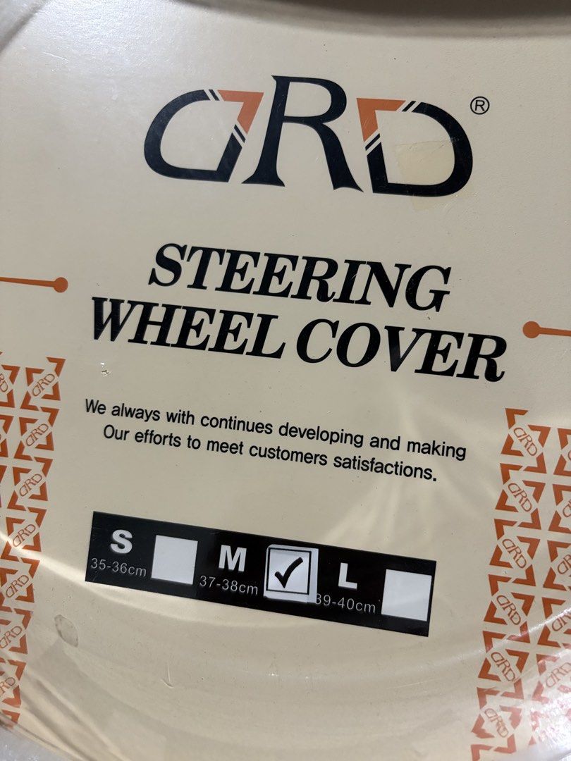 GRD Steering Wheel Cover Size M (Category: Steering, Brakes, Control Parts and Accessories) located in Marikina City. Submitted by kim_sanaaa (Listing ID 1466772413, Image 3). Description: - Brand: GRD - Condition: Brand new, never used, still in original packaging - Size: Medium (fits 37 to 38 cm steering wheels) - Color: Black - Feature: Wavy textured pattern designed for extra grip and control.