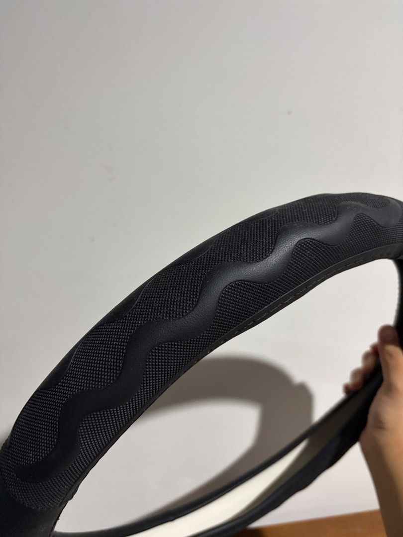 GRD Steering Wheel Cover Size M (Category: Steering, Brakes, Control Parts and Accessories) located in Marikina City. Submitted by kim_sanaaa (Listing ID 1466772413, Image 2). Description: - Brand: GRD - Condition: Brand new, never used, still in original packaging - Size: Medium (fits 37 to 38 cm steering wheels) - Color: Black - Feature: Wavy textured pattern designed for extra grip and control.