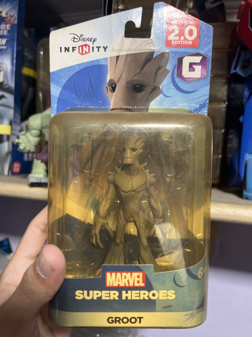 Groot (GOTG) -Disney Infinity 2.0 Marvel Super Heroes Figure (Category: Figurines & Statues) located in Quezon City. Submitted by thegroovearchive (Listing ID 1466674637, Image 1). Description: - Character: Groot from Guardians of the Galaxy (Disney Infinity 2.0 Marvel Super Heroes) - Condition: Brand new, unopened in original blister pack with minor shelf wear and small handwriting on the front upper left - Compatibility: Works with the Disney I