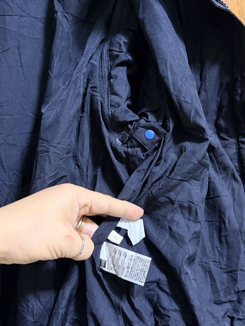 GU Black Puffer Jacket Size 140 (Category: Babies & Kids Fashion) located in Paete. Submitted by skydruemadison (Listing ID 1466677018, Image 2). Description: - Brand/Style: GU kids padded winter jacket - Color: Dark navy blue - Size: 140 tag - Features: Full front zipper, high collar neck, two warm front pockets - Condition: Lightweight, clean inner lining, fully working zipper, great for cold weather.