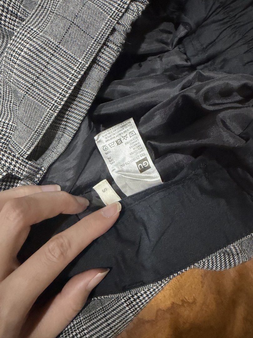 GU Gray Plaid Midi Skirt Size S (Category: Skirts) located in Manila. Submitted by lifewithmazel (Listing ID 1466583631, Image 3). Description: - Brand: GU - Size: S (tag attached) - Pattern: Gray plaid - Style: High waist with matching fabric front-tie belt - Comfort: Back slit at the bottom hem for easy movement - Lining: Fully lined with smooth black fabric.