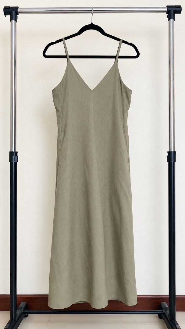GU Olive Green (Category: Dresses) located in Cebu City. Submitted by prettynuttyoushop (Listing ID 1466683958, Image 1). Description: - Brand: GU - Color: Olive Green - Size: S - Material: 100% Polyester (includes recycled polyester fibers) - Design: Simple crew neck, sleeveless cut, straight hemline with lining - Fabric: Lightweight and breathable - Style: Easy everyday throw-on piece - Care: Standard care instructions on inner tag - Manage exp