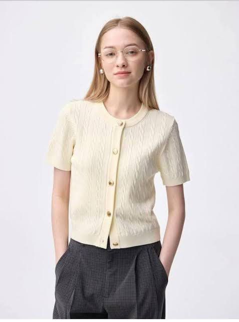 GU Short Sleeve Cable Knit (Category: Blouses) located in Tarlac. Submitted by joshualyn2011 (Listing ID 1466607309, Image 1). Description: - Brand/Model: GU short sleeve cable knit cardigan - Color: Creamy yellow - Details: Crew neckline, gold-tone front buttons, ribbed hem and cuffs - Fit/Style: Short sleeves, classic minimalist look - Perfect for: Warm-weather layering, easy to pair with trousers or skirts -Good as brand new.