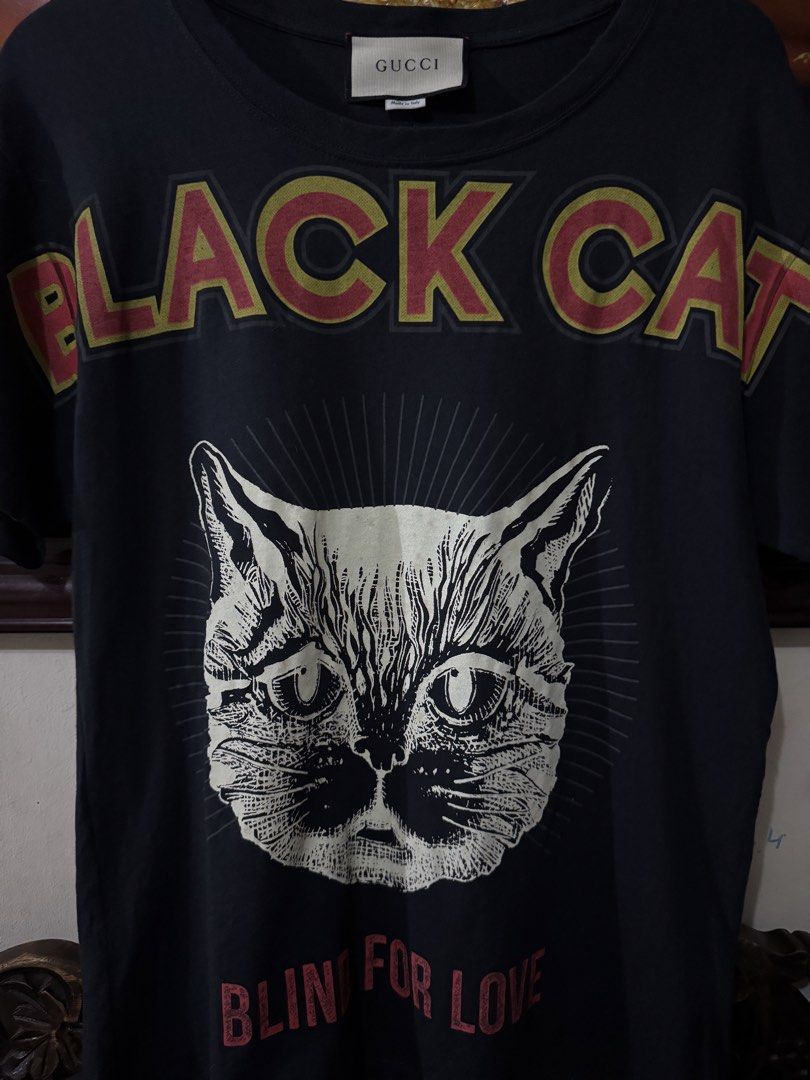 GUCCI BLACK CAT TSHIRT (Category: Tshirts & Polo Shirts ) located in Manila. Submitted by puremoon.deer (Listing ID 1466670601, Image 3). Description: FOR SALE GUCCI BLACK CAT TSHIRT "BLIND FOR LOVE" EXCELLENT CONDITION ISSUE CUT WASHTAG SMALL on TAG 19.5x26.5 DM/PM📥📥📥IF YOU ARE INTERESTED.