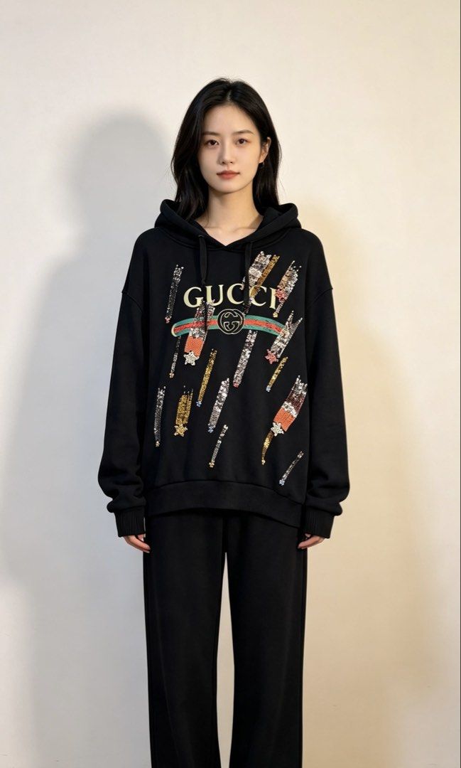 Gucci Black Sequin Logo Hoodie (Category: Coats, Jackets and Outerwear) located in Paranaque City. Submitted by preluxeshop_ph (Listing ID 1466764778, Image 1). Description: Gucci Black Sequin Logo Hoodie - Features eye-catching sequin logo detail - Made in Italy for premium quality - Comfortable and stylish design - Ideal for everyday casual wear .