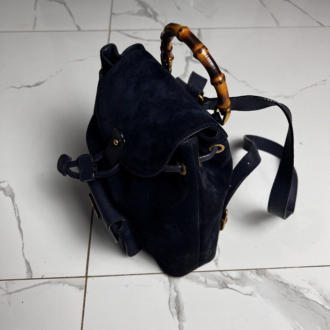 Gucci Suede Bamboo Backpack (Category: Backpacks) located in San Fernando. Submitted by jebeanjebb (Listing ID 1466581785, Image 2). Description: Authentic Gucci navy blue suede and textured leather backpack featuring a chic bamboo top handle, gold hardware, and secure drawstring closure. Orig 💯 In very very good condition Details already posted ₱13,500 + shipping fee outside my area (lowest in the market) Location: San Fernando City La Union Sh