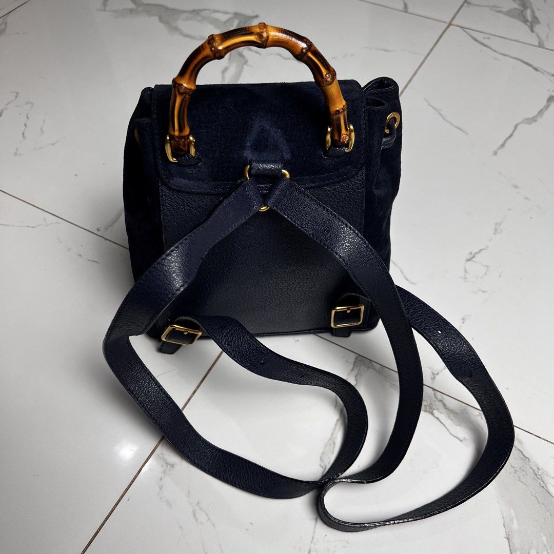 Gucci Suede Bamboo Backpack (Category: Backpacks) located in San Fernando. Submitted by jebeanjebb (Listing ID 1466581785, Image 3). Description: Authentic Gucci navy blue suede and textured leather backpack featuring a chic bamboo top handle, gold hardware, and secure drawstring closure. Orig 💯 In very very good condition Details already posted ₱13,500 + shipping fee outside my area (lowest in the market) Location: San Fernando City La Union Sh