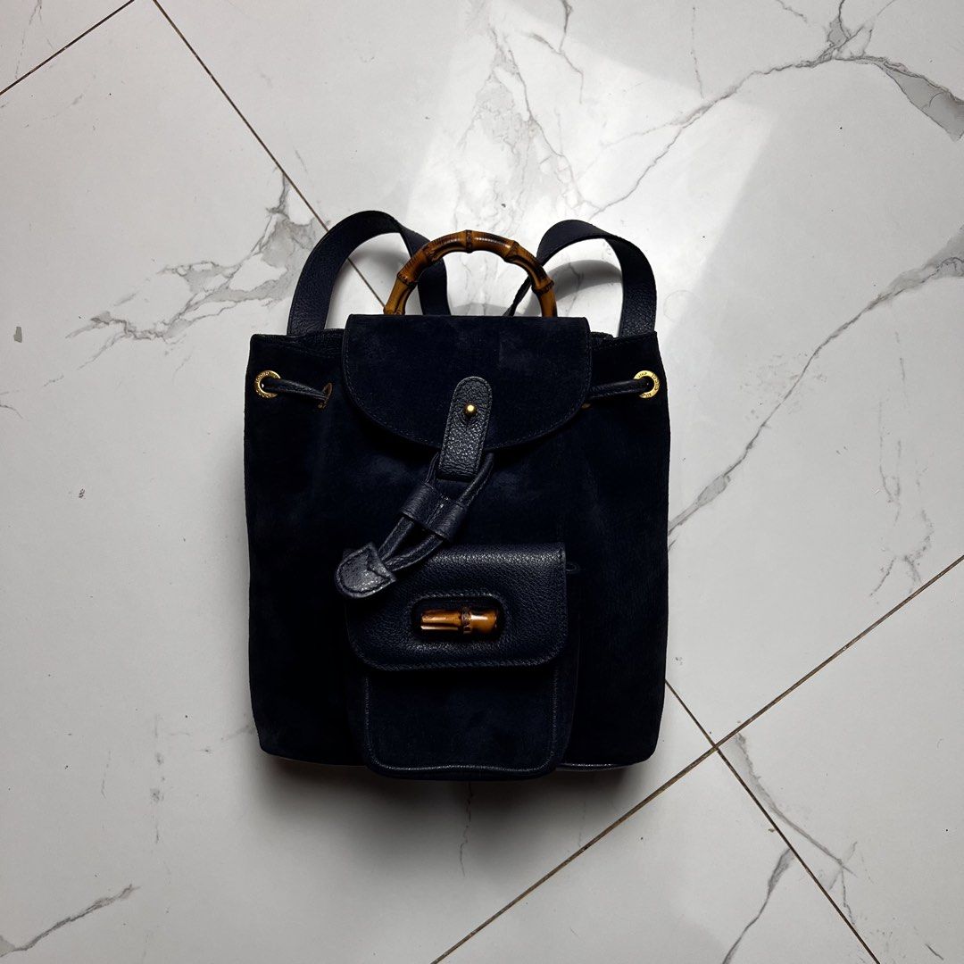 Gucci Suede Bamboo Backpack (Category: Backpacks) located in San Fernando. Submitted by jebeanjebb (Listing ID 1466581785, Image 1). Description: Authentic Gucci navy blue suede and textured leather backpack featuring a chic bamboo top handle, gold hardware, and secure drawstring closure. Orig 💯 In very very good condition Details already posted ₱13,500 + shipping fee outside my area (lowest in the market) Location: San Fernando City La Union Sh