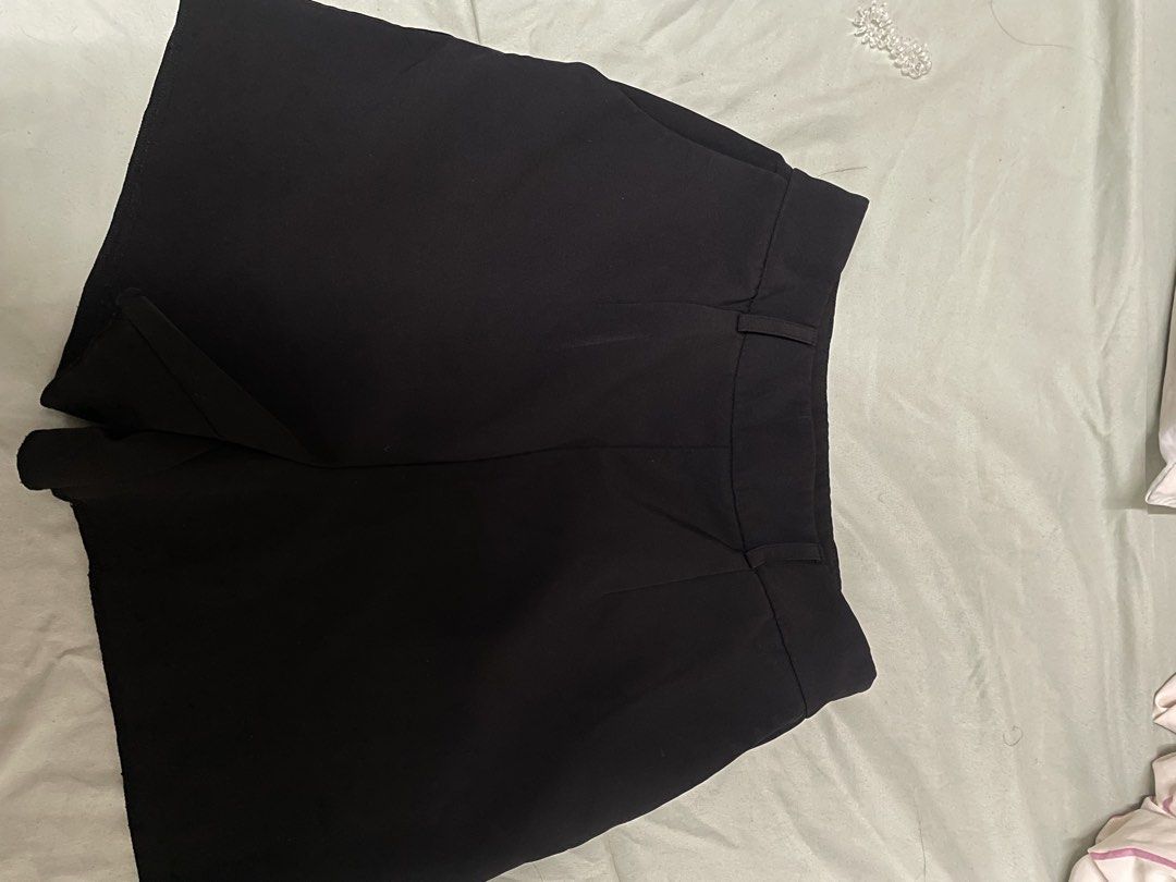 Guess Black Tailored Shorts (Category: Shorts) located in Davao. Submitted by keshichua (Listing ID 1466745961, Image 1). Description: - Brand: Guess - Color: Solid black - Style: Classic tailored shorts with belt loops - Details: Two back welt pockets with silver Guess logo plaque on the right, green inner brand tag - Condition: Great basic piece for dressing up or keeping it casual.