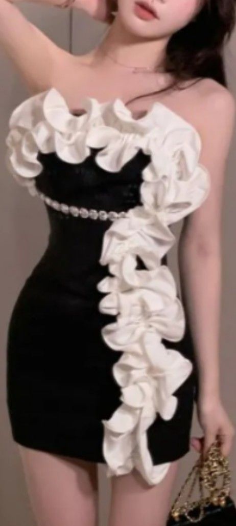 Gultown Strapless Two Tone Ruffle Mini Sheath Dress (Category: Dresses) located in Manila. Submitted by anez06 (Listing ID 1466694910, Image 1). Description: - Style: Form-fitting black and white sheath mini dress - Design: Strapless neckline with dramatic cascading white ruffles - Detailing: Sparkling rhinestone belt at the waist - Condition: Worn once for photos, practically brand new - Occasion: Perfect for parties, clubs, and night outs.