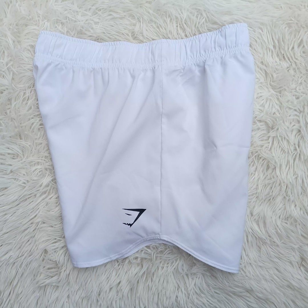 Gymshark White Running short (Category: Shorts) located in Gattaran. Submitted by thrift_wiseph (Listing ID 1466677465, Image 1). Description: - Brand: Gymshark - Color: White with black logo near hem -issue nasa mismong pic.