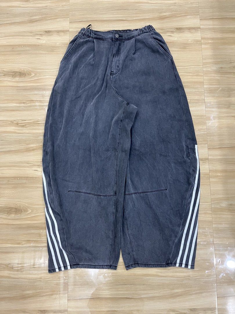 Acid Wash Denim Pants with Side Stripes (Category: Jeans) located in Angeles City. Submitted by thriftsij (Listing ID 1466743664, Image 1). Description: -Dark grey acid wash denim pants. -Size M (Freesize) -40 l 17 Thigh 11 lo -Relaxed baggy fit Three white side stripes running down both legs. -Durable denim fabric with a worn-in vintage look. -Great streetwear piece, easy to style with oversized tees or hoodies..