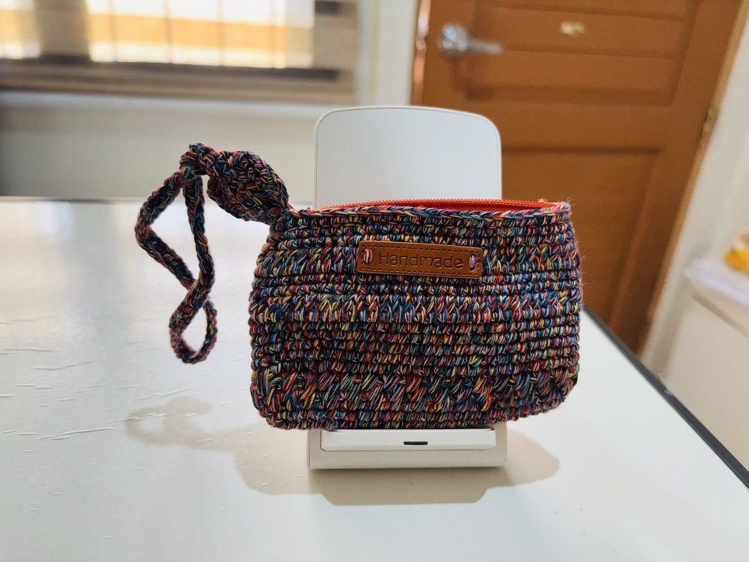 Handmade Crochet Coin Pouch with Wrist Strap (Category: Purses & Pouches) located in Iloilo. Submitted by letsgoshopping20 (Listing ID 1466566585, Image 2). Description: - Handmade crochet pouch with soft textured yarn - Secure zipper closure to keep items safe - Convenient wrist strap for easy carrying - Stylish faux leather "Handmade" front label - Compact and versatile size for coins, keys, or cards - Neat stitching throughout for durability.