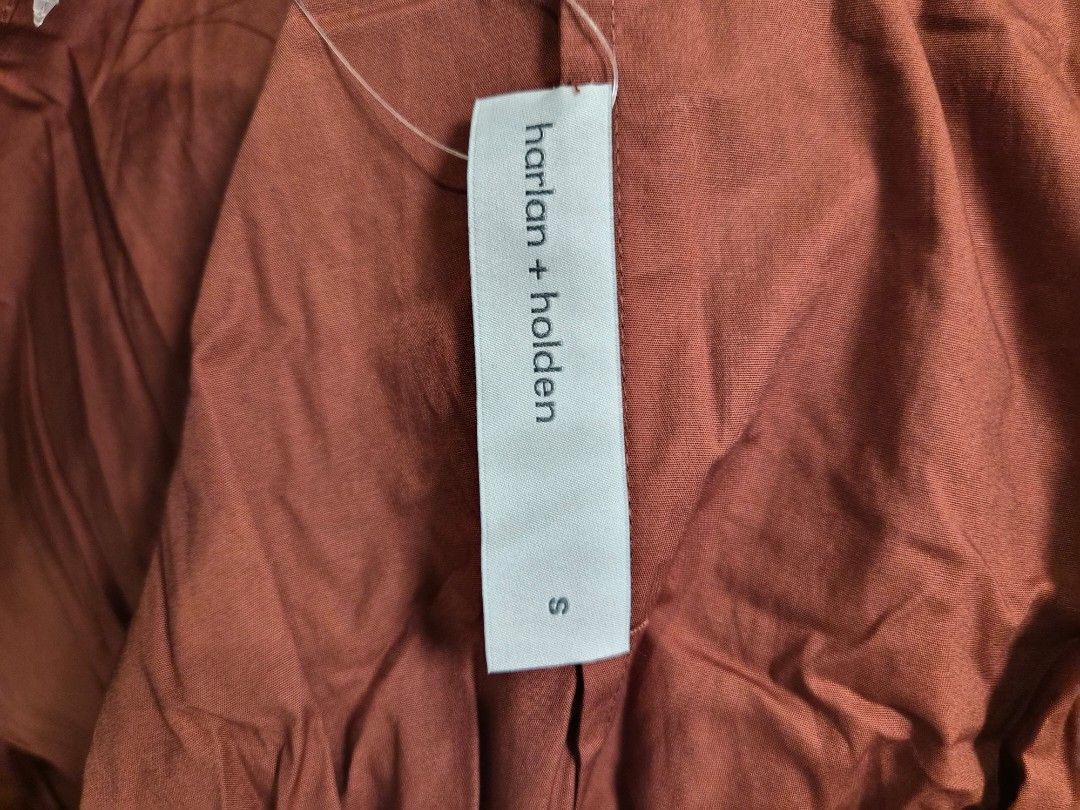 harlan + holden structured button-down blouse in rust (Category: Blouses) located in Manila. Submitted by prelovedbyc.hannah (Listing ID 1466711302, Image 3). Description: - Harlan + holden long-sleeve button-down shirt - Rich rust brown color - Size S - Cotton and lycra blend fabric - Collared neck with button cuffs and waist paneling design - Tag still attached - Machine washable..