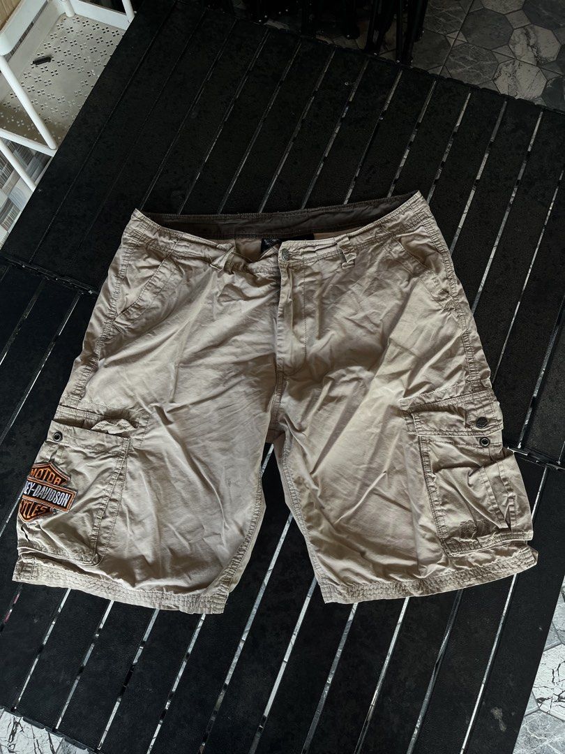 Harley Davidson Beige Cargo Shorts (Category: Shorts) located in Tuguegarao City. Submitted by josh_the_thrift (Listing ID 1466571576, Image 1). Description: - Brand: Harley-Davidson - Color: 8.5/10 Tan Khaki,may vary due to lightning - Material: 100% cotton with ripstop texture - Branding: Embroidered bar & shield patch on right pocket, H-D embroidery on left.