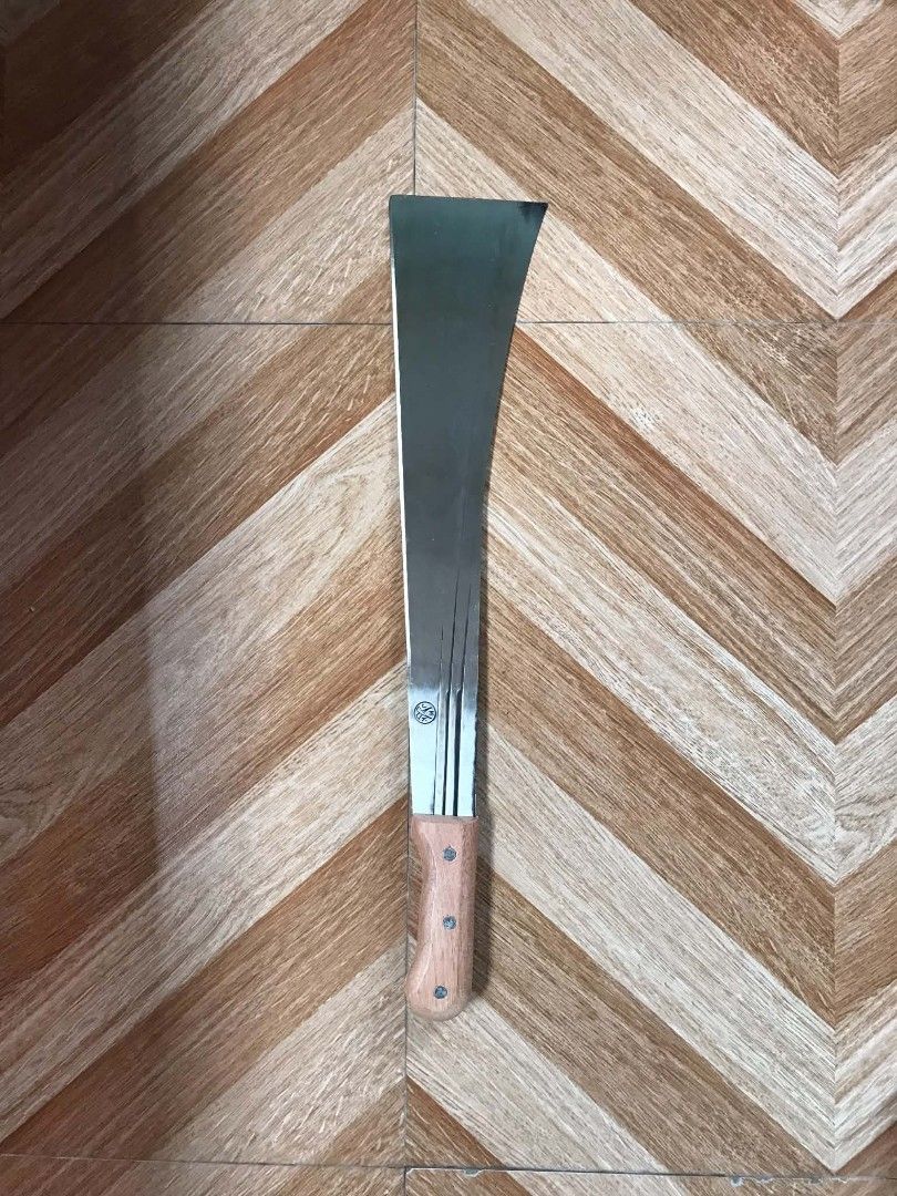 Heavy Duty Machete with Wooden Handle (Category: Knives & Chopping Boards) located in Quezon City. Submitted by davidmelvin28 (Listing ID 1466576770, Image 1). Description: - Sharp and sturdy machete - Ideal for clearing brush or gardening - Comfortable wooden handle for easy grip - Blade has minor scratches, but is in good, usable condition - Ready for its next task.