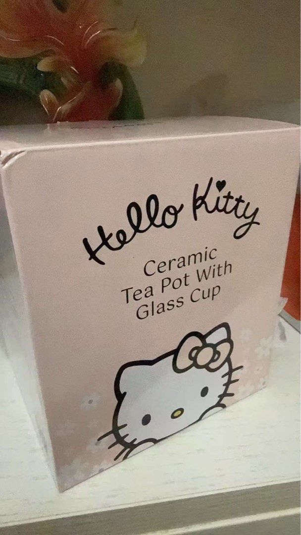 Hello Kitty Ceramic Tea Pot With Glass Cup (Category: Coffee & Tea Tableware) located in Manila. Submitted by janetecson05 (Listing ID 1466650477, Image 2). Description: - Authentic Kitty ceramic tea pot set with a matching glass cup - Adorable pastel pink and blue design featuring a 3D Kitty and cute bear on the lid - Beautiful floral patterns printed across the pot body - Comes with its original box, great for gifting or display - Perfect addit