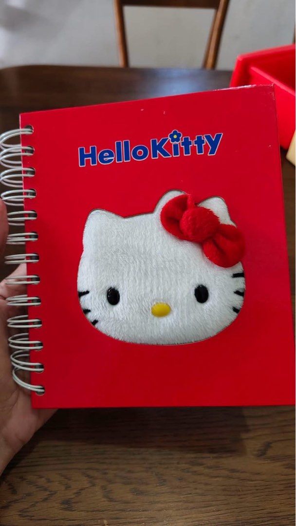 Hello Kitty Spiral Notebook Planner with Plush Cover (Category: Stationery & School Supplies) located in Manila. Submitted by janetecson05 (Listing ID 1466649074, Image 1). Description: - Official Sanrio-themed spiral notebook featuring a fluffy Kitty plush patch with her signature red bow - Week-at-a-glance layout (Monday to Sunday) with adorable character borders and space for daily notes - Durable red wire binding to keep your pages secure - G