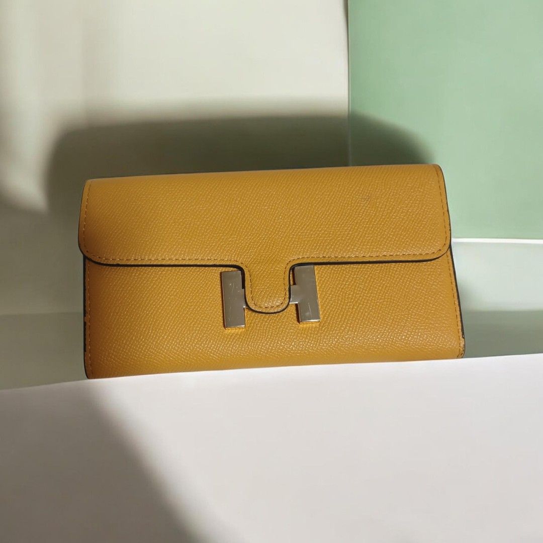 Hermes Constance Long Wallet Yellow Leather Silver Hardware (Category: Luxury Bags & Wallets) located in Umingan. Submitted by mrobvariety (Listing ID 1466625084, Image 1). Description: - Brand: Hermes - Style: Constance Long Wallet - Color: Mustard Yellow - Material: Textured Leather - Hardware: Silver-tone with iconic H clasp - Interior: Multiple card slots and spacious compartments - Condition: Excellent with clean edge stitching and minimal s