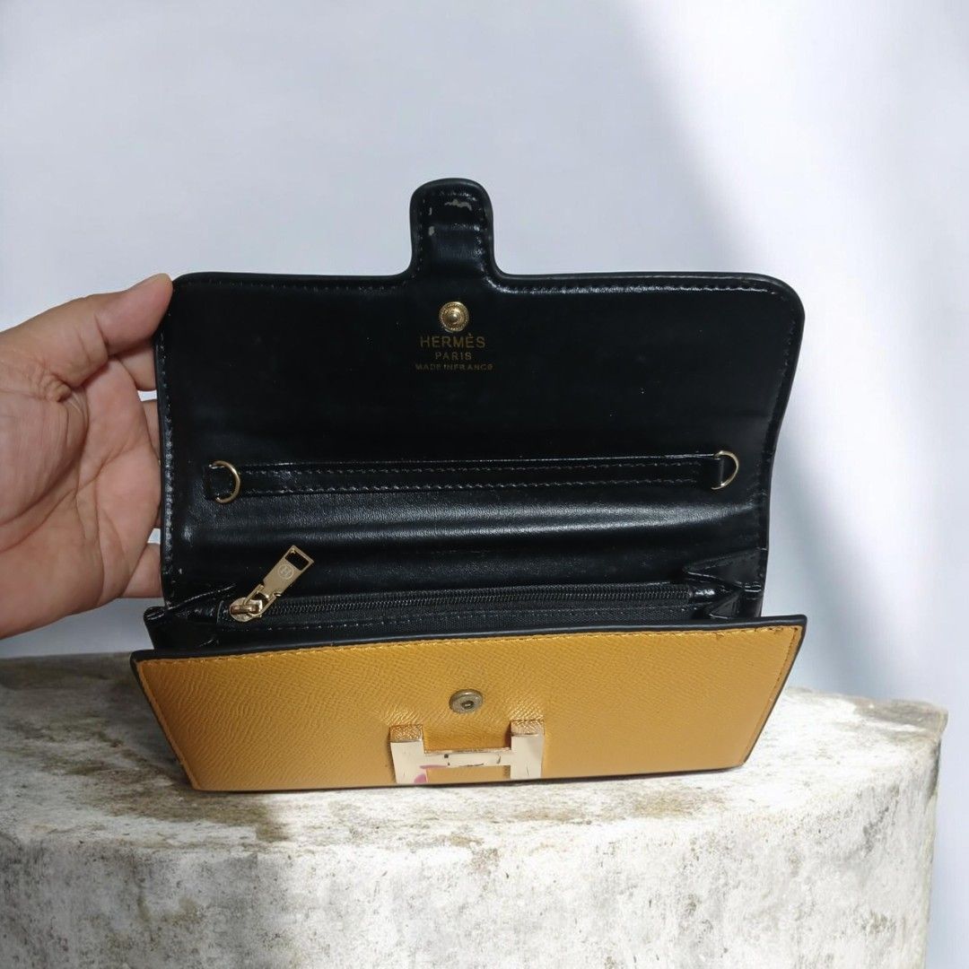 Hermes Constance Long Wallet Yellow Leather Silver Hardware (Category: Luxury Bags & Wallets) located in Umingan. Submitted by mrobvariety (Listing ID 1466625084, Image 3). Description: - Brand: Hermes - Style: Constance Long Wallet - Color: Mustard Yellow - Material: Textured Leather - Hardware: Silver-tone with iconic H clasp - Interior: Multiple card slots and spacious compartments - Condition: Excellent with clean edge stitching and minimal s