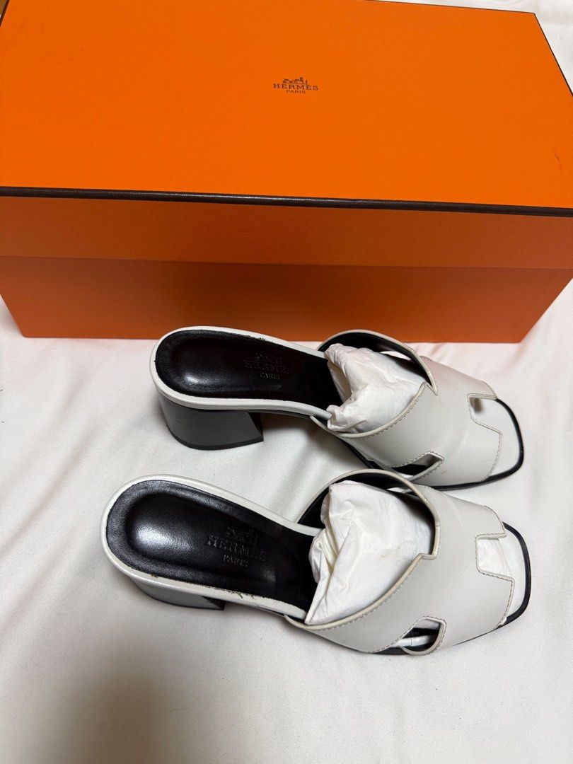 Hermes White Leather Block Heel Sandals (Category: Flats & Sandals) located in San Juan City. Submitted by krishvee (Listing ID 1466732664, Image 2). Description: HERMÈS Block Heel Sandals | Size 35 Condition: Excellent, lightly used Inclusions: Dustbag & Box Original Price: ₱65,000 Selling Price: ₱29,500 Price is negotiable. DM for actual photos and details..