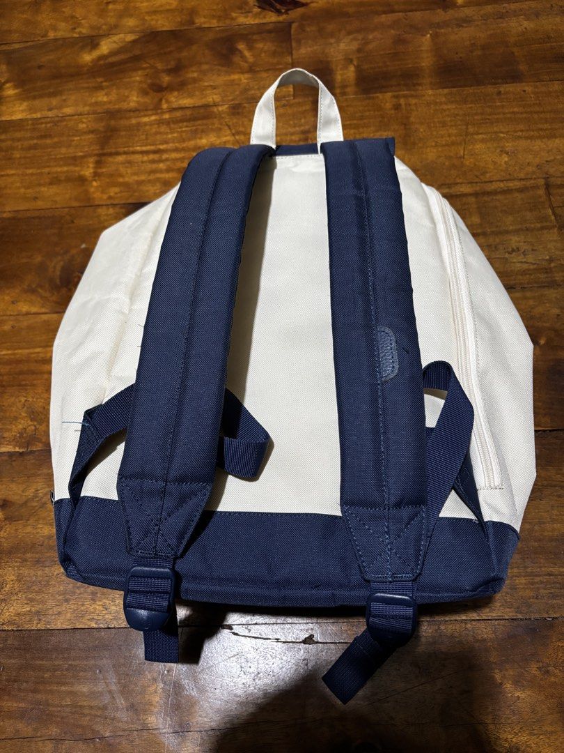 Herschel Supply Co. x Beams Backpack (Category: Backpacks) located in Malaybalay. Submitted by ziggyy. (Listing ID 1466693935, Image 3). Description: - Authentic Herschel Supply Co. x Beams collaboration backpack - Stylish white canvas body with a contrast navy blue base and top flap - Secure drawstring closure with snap button fasteners - Vibrant orange and white striped inner lining with an interior zip pocket - Comfortable adjustable padded sh